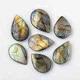 Natural Crystal Blue Light Elongates Stone Droplets